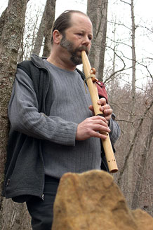 Aumdoc playing his flute